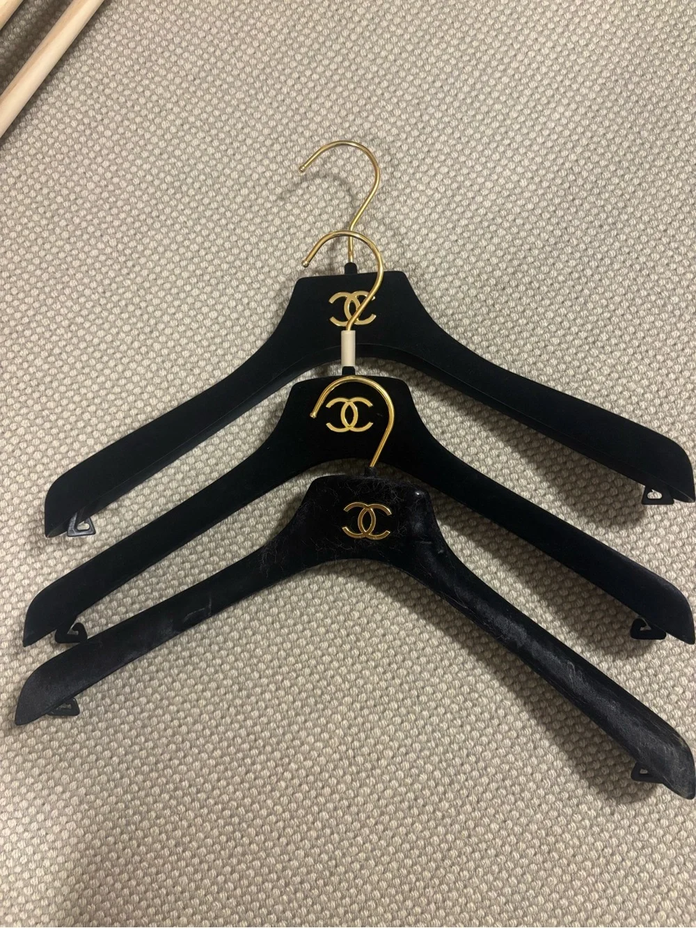 CHANEL Black and Gold Velvet Hangers with Signature CC Emblems